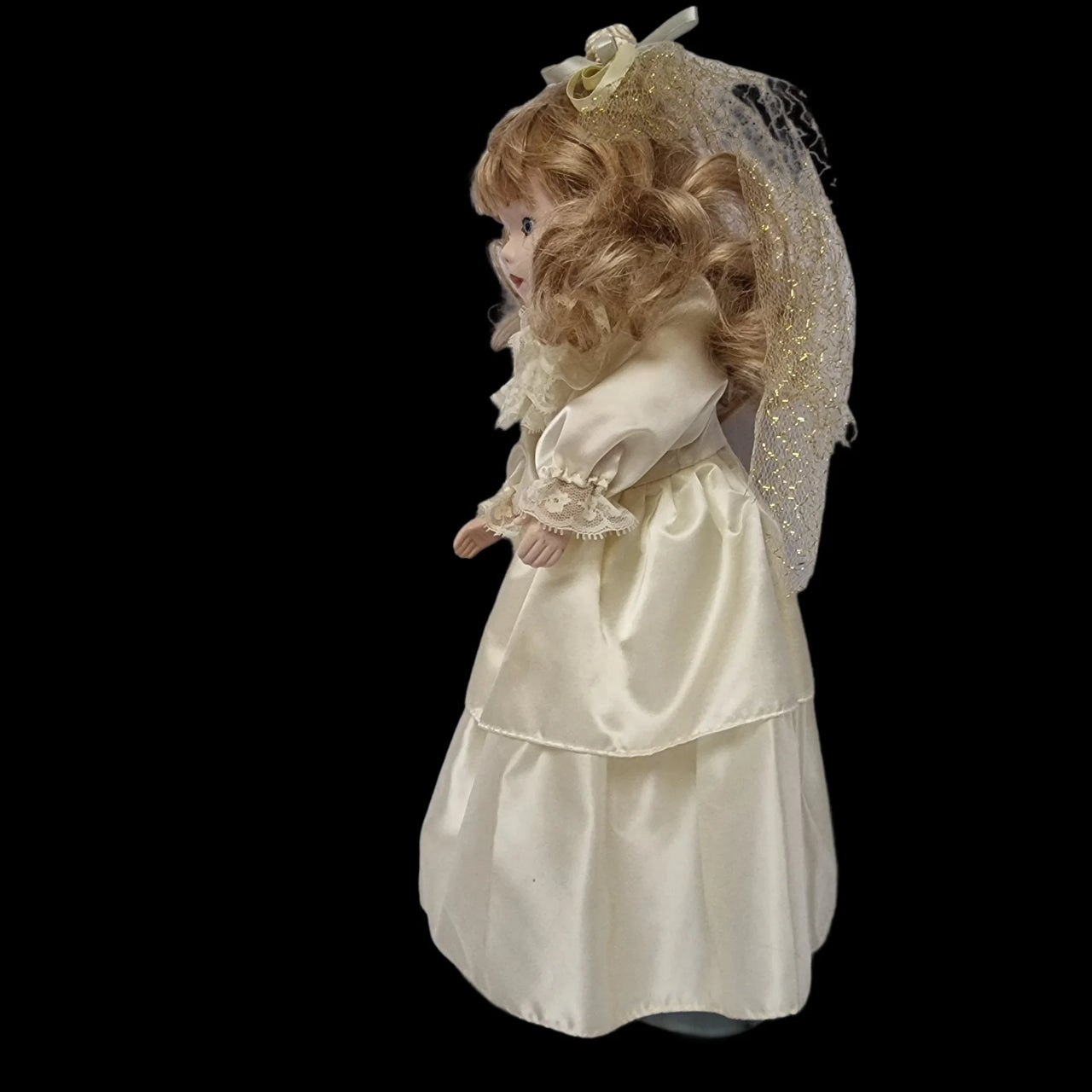 Praying top porcelain doll